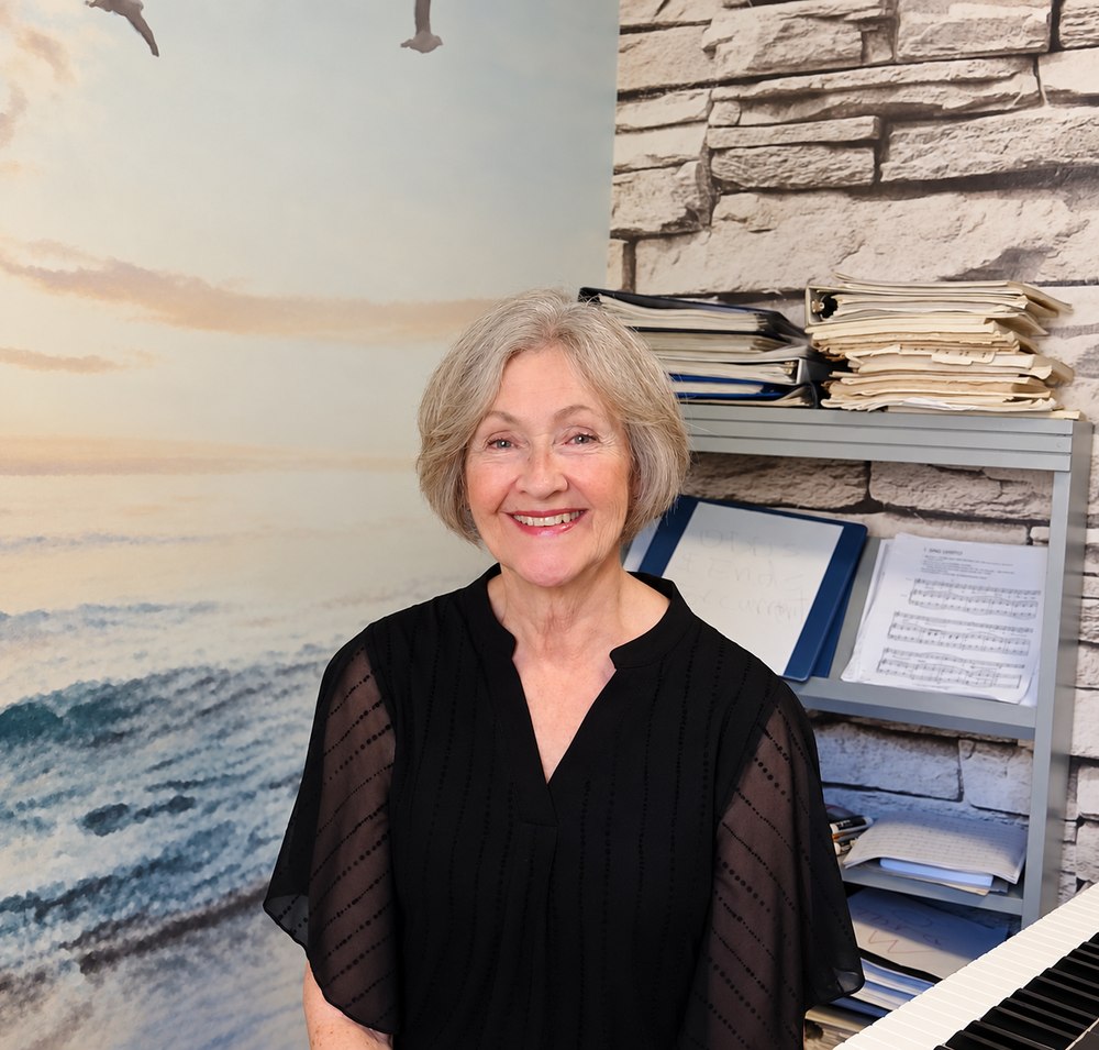 Becky Oexler at the keyboard in her teaching studio